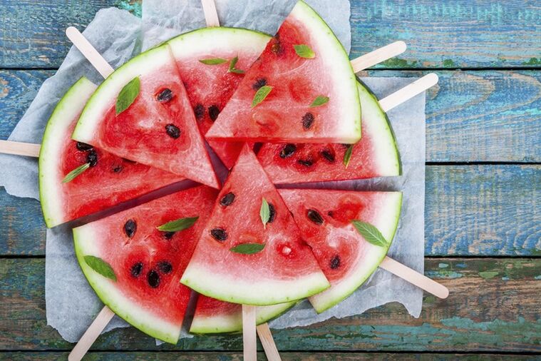 Slices of watermelon on sticks for a snack on a watermelon diet